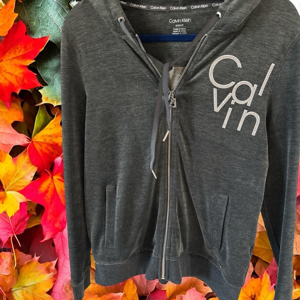 Calvin Klein Charcoal Full Zip-Up Hoodie.Calvin is in Rhinestones. Great shape.